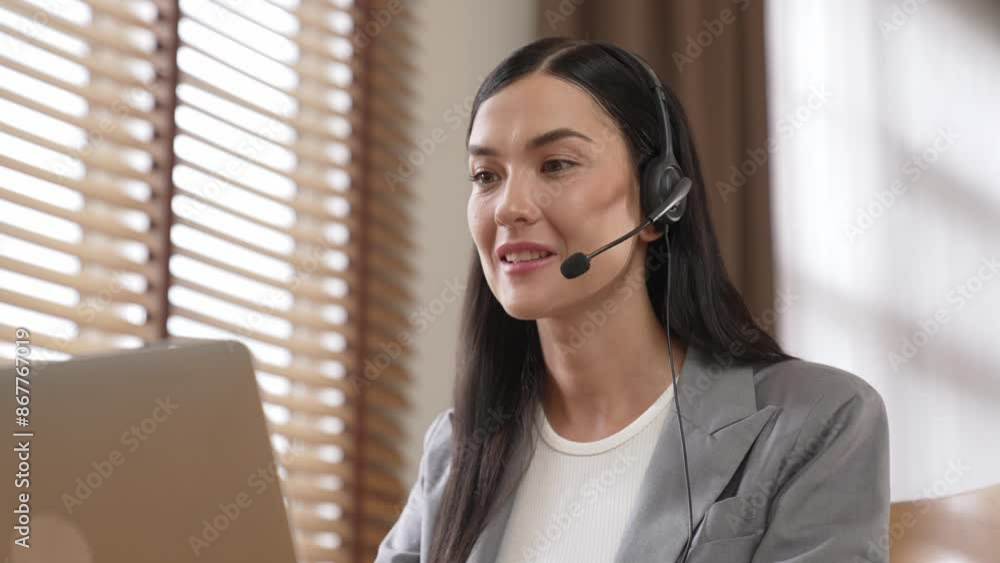 Aufkleber female call center operator or customer service helpdesk staff working on workspace while talking on