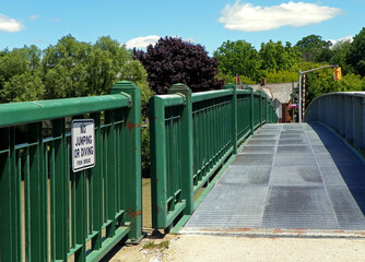 No Jumping sign on a bridge over a river.