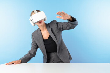 Project manager wearing VR headset and standing while holding innovation technology hologram....