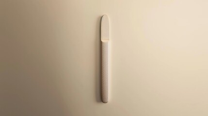 White Plastic Nail File On Beige Surface