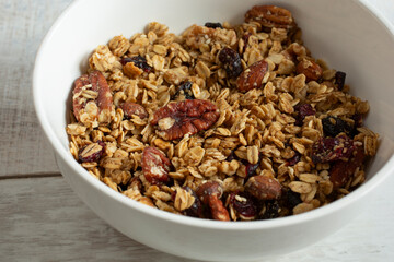 A view of a bowl of granola cereal.