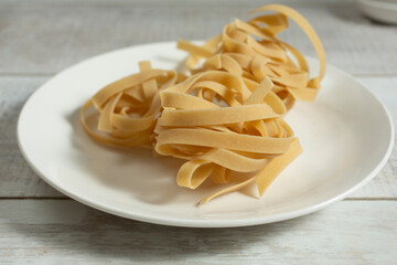 A view of dry bundles gluten-free tagliatelle pasta.