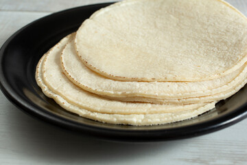 A view of a stack of corn tortillas.