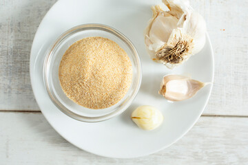 A top down view of a variety of forms of garlic.