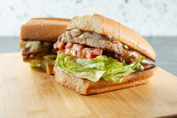 A view of a ribeye steak sandwich.
