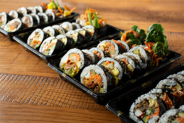A view of a row of gimbap trays. © DAVID