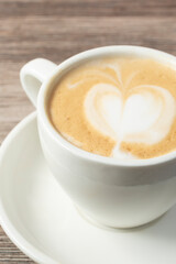 A closeup view of a small mug of cortado.