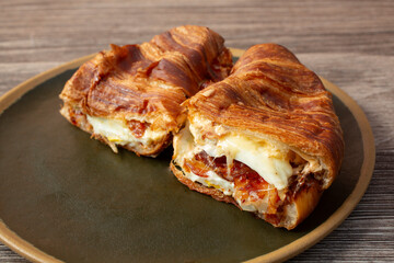 A view of a croissant breakfast sandwich.