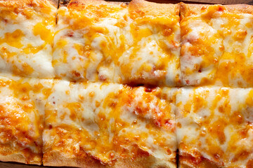 A top down view of a cheese flatbread.
