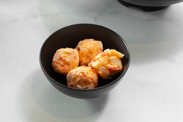 A view of a small bowl of fishballs.