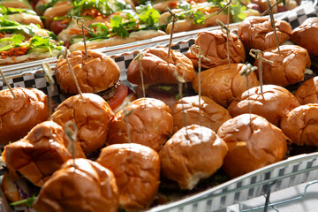A view of a catering tray of sliders, seen at local event.