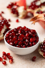 Pomegranate. Fresh organic juicy pomegranate fruit pieces. Pomegranate seeds, grains.