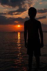 Beautiful colorful sunset background with sun on the horizon. Sucre, Colombia.