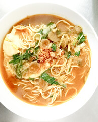 Selective focus. Bakmie Jawa or Mie Nyemek. Javanese Noodle Soup Popular from Yogyakarta, Indonesia. Sweet and Savory Traditional Recipe Noodle.
