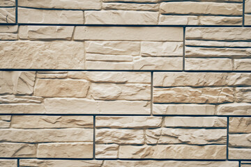 The texture of the stone. Uneven tiles with protruding parts and cracks. With space to copy. High quality photo