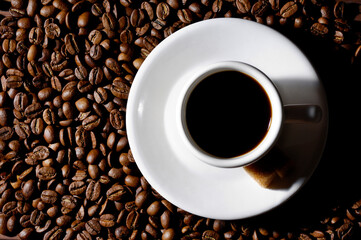 Cup of Black Coffee on Coffee Beans