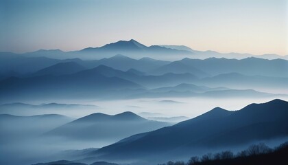 mountain layers and sunrise view in cold and foggy weather.
