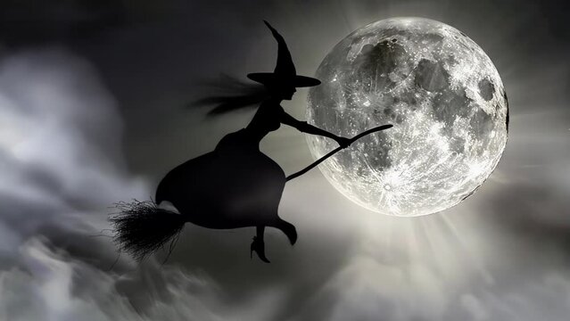 witch in a classic black robe flies on a broom against the backdrop of a bright full moon and starry sky. Mystical and magical atmosphere