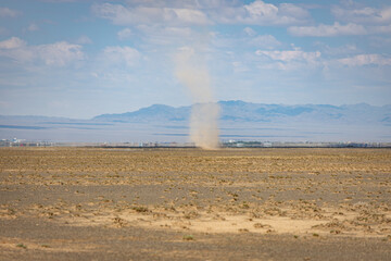 Sandstorm over the desert landscape surrounding the city of Dalanzadgad.