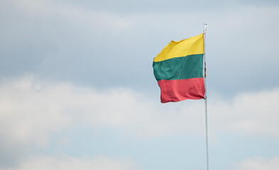 Lithuanian Flag is Waving in Blue Sky Background