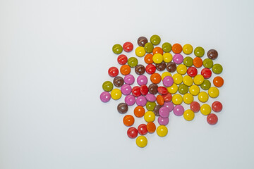 Candy coated chocolate on white background.