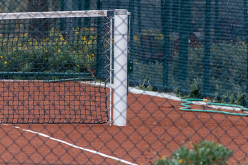 tennis court with net and ball