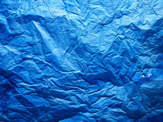 Abstract blue color background. Painted paper texture. Denim colour.