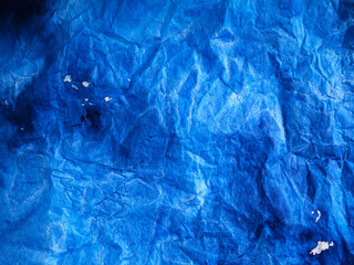 Abstract blue color background. Painted paper texture. Denim colour.