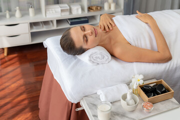 Caucasian woman customer enjoying relaxing anti-stress spa massage and pampering with beauty skin...