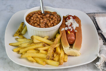 hot dog  with  baked beans and french fries,