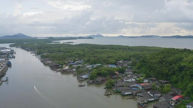Aerial view of Ranong City, The Floating village urban city town houses, lake sea or river. Nature landscape fisheries and fishing tools, Thailand. Aquaculture farming