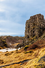 Rocky mountain tops in nordic scenery, thingvellir national park with spectacular landscapes and stone hills in iceland. Highland rock formations creating cliffs near icelandic valley.