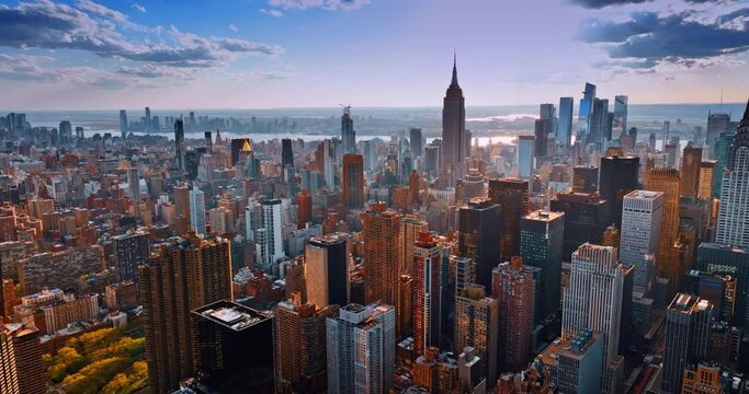 Urban scenery of New York in the light of setting sun. Amazing metropolis from aerial perspective.
