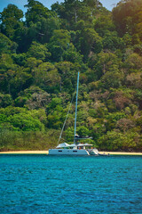 the yacht is anchored at sea