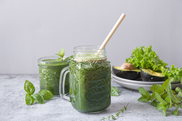 Blended green smoothie with ingredients. Healthy smoothie