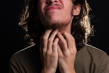 Man scratching his neck with his hand. Skin disease. Irritation, allergy.