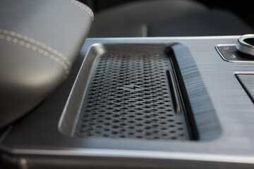 A thorough examination of the wireless phone charger installed within a cars cabin
