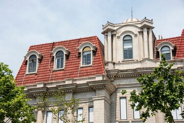 Obraz premium Historic European-style building with red-tiled roofs and ornate details in Wuhan, China