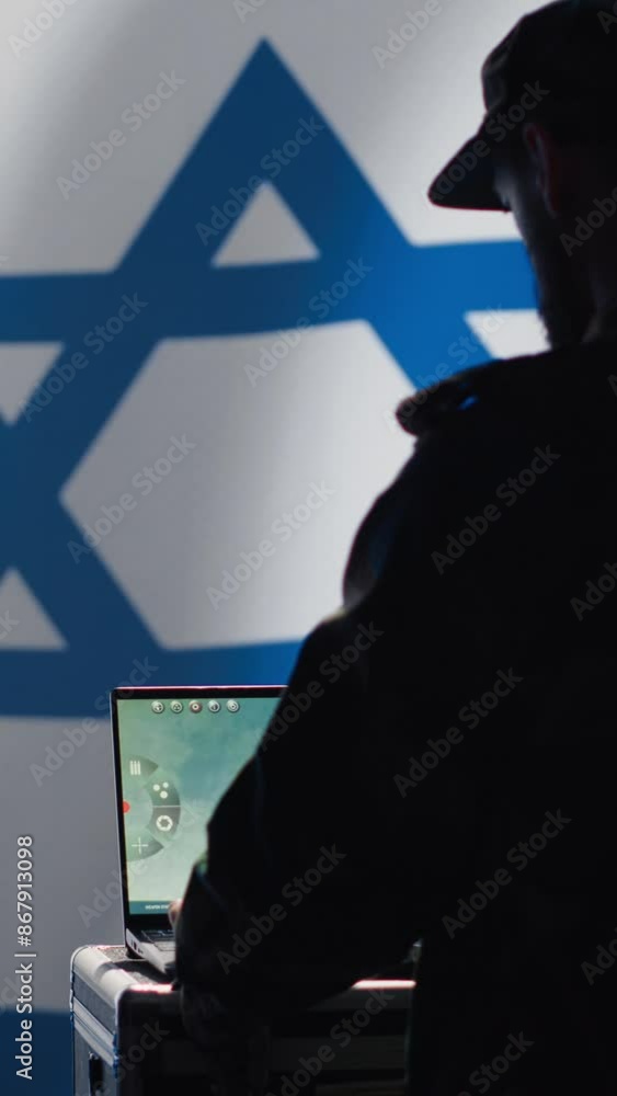 Poster vertical video iranian conscript in control room uses military tech to identify threats from enemies