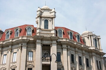 Fototapeta premium Historic European-style building with red-tiled roofs and ornate details in Wuhan, China