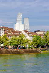 Basel city- Two tall buildings with a green spire on top