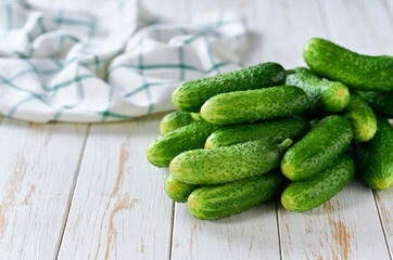 fresh cucumbers on the wooden table with copy space for text.