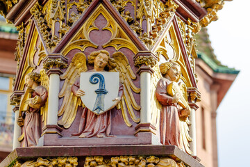 A large, ornate building with a gold and red color scheme