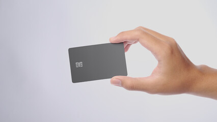 Hand showing credit card, or card, or business card or voucher, isolated on white background, template, mock-up