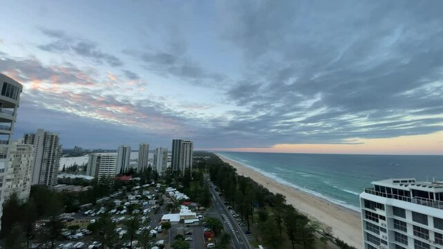 Sunset time lapse clouds over the city, Main Beach, Gold Coast, Australia.