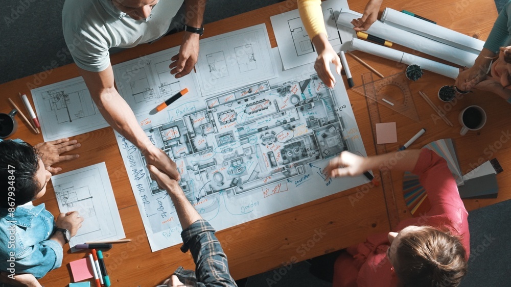 Poster top down view of smart business people shaking hands and making a contract. aerial view of architect