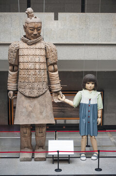 Xi'an, China - December 18th 2010 - The Warrior and the Girl marionettes on display at the Emperor Qin Shihuang Mausoleum Site Museum. These were used during the 2008 Beijing Olympic Games