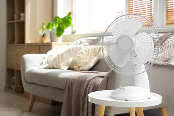 Electric fan on table in living room