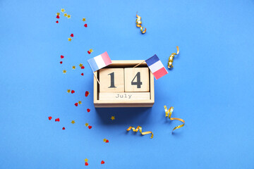 Cube calendar with date 14 JULY, flags of France, hearts and confetti on blue background. Bastille...