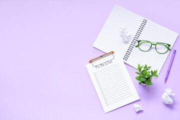 Todo list, eyeglasses and notebook on lilac background